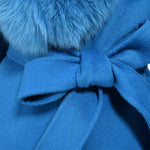 Long blue winter coat with furry sleeves