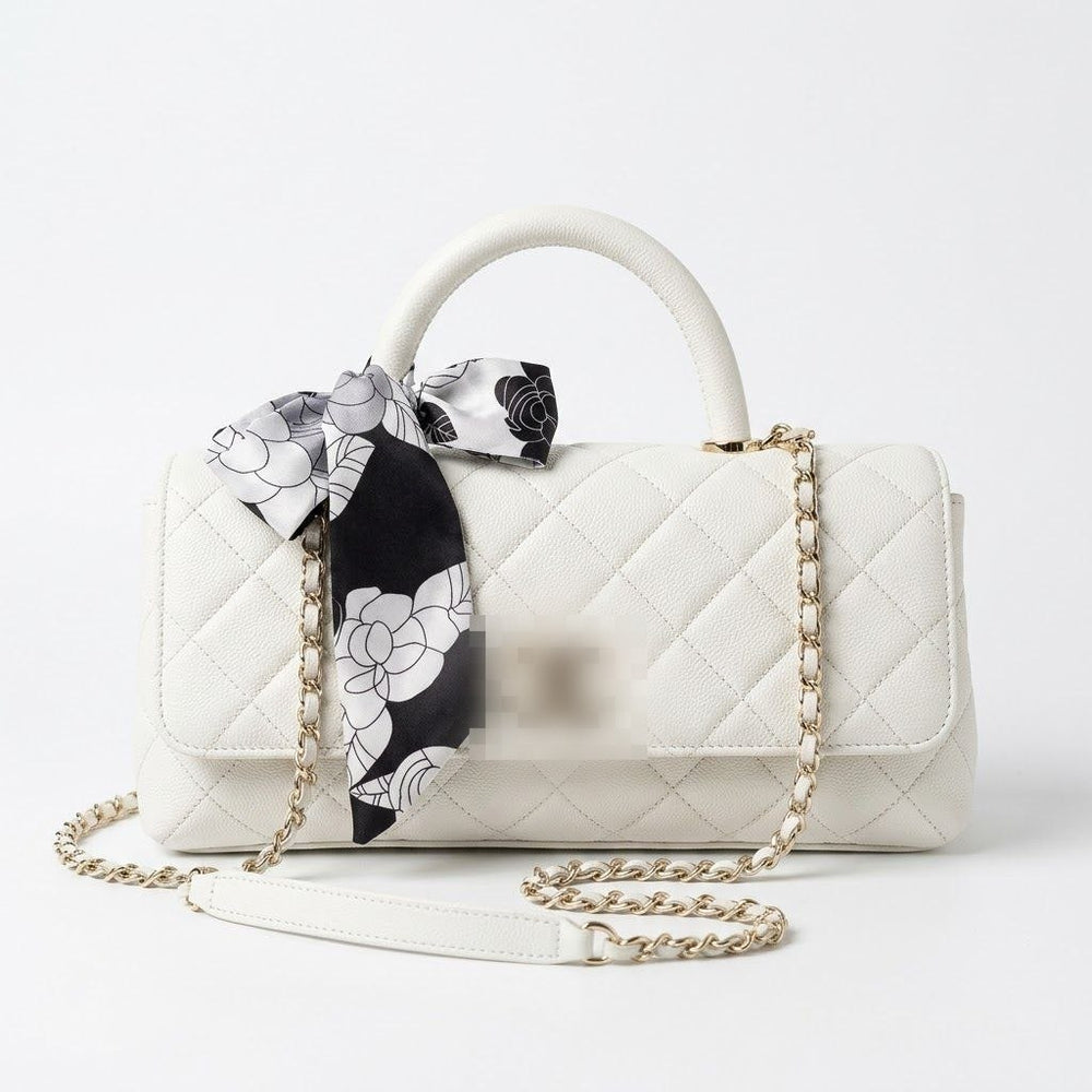 leather handbag with a top handle, gold-tone chain strap