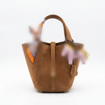 A brown suede bucket bag