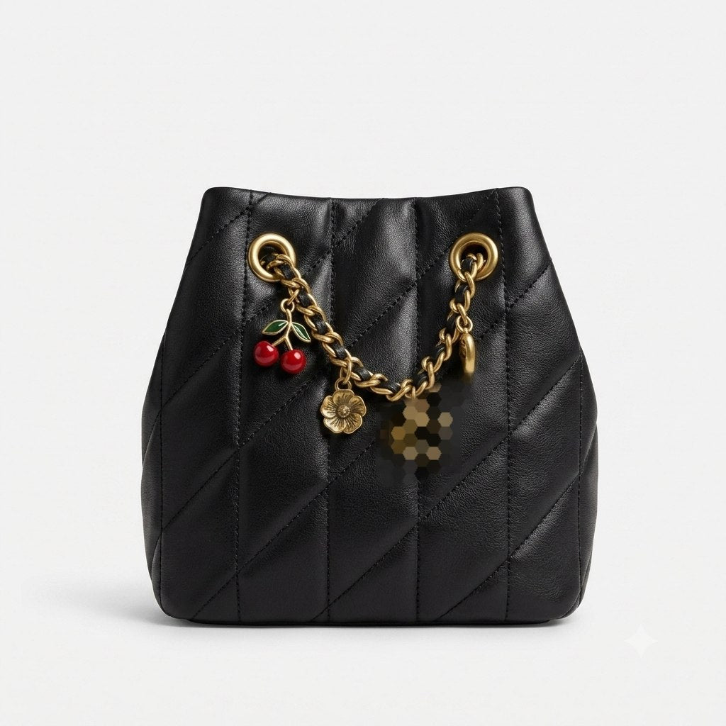 Small bucket bag adorned with attractive accessories