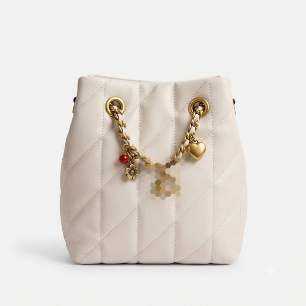 Small bucket bag adorned with attractive accessories
