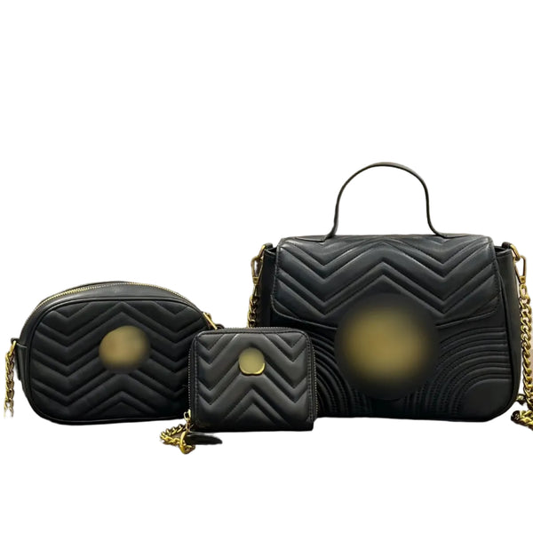 Three black quilted handbags