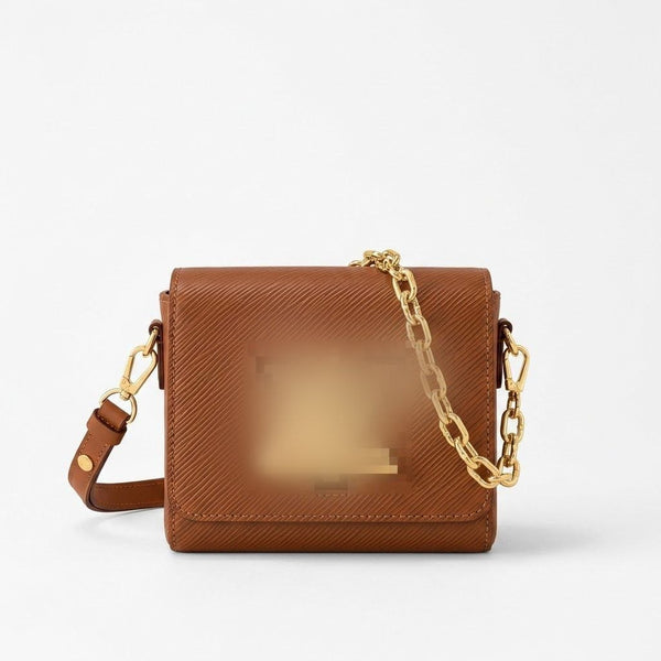 textured leather crossbody bag with a gold chain strap and gold