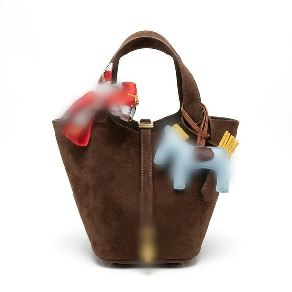 A brown suede bucket bag
