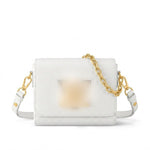 textured leather crossbody bag with a gold chain strap and gold