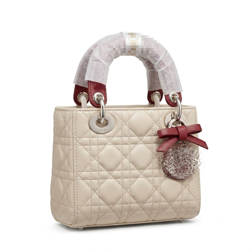 Elegant Leather Bag with Metal Charms and Bow Detail