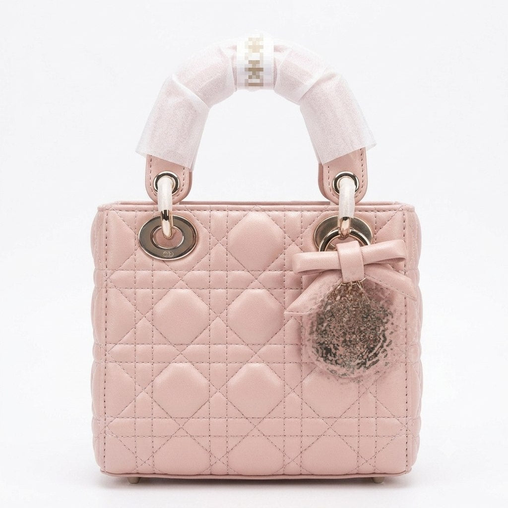 Elegant Leather Bag with Metal Charms and Bow Detail