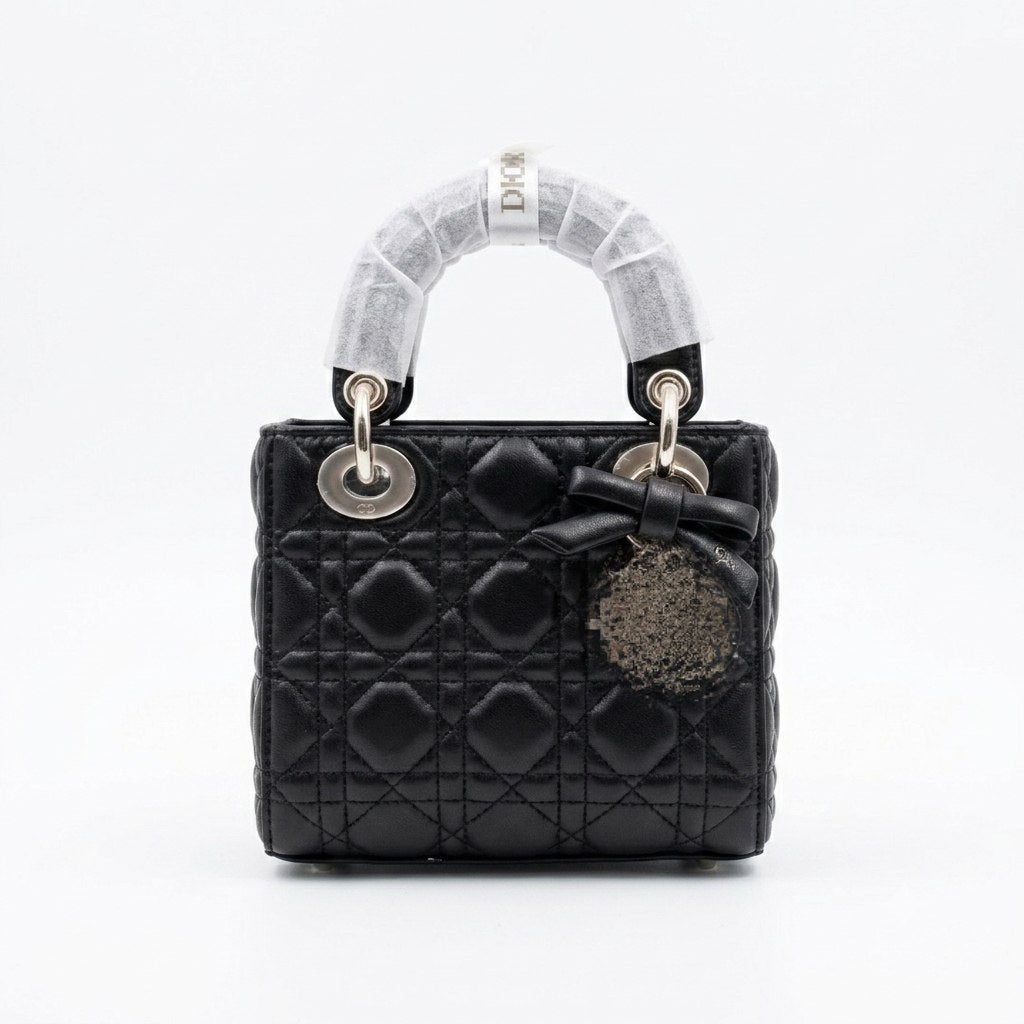 Elegant Leather Bag with Metal Charms and Bow Detail